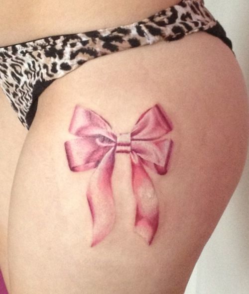 Bow ink on finger Tattoo on skin