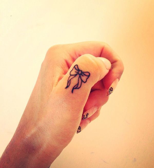Purple ribbon bow art Tattoo on skin
