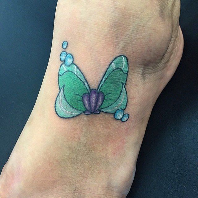 Thigh bow ink passion Tattoo on skin
