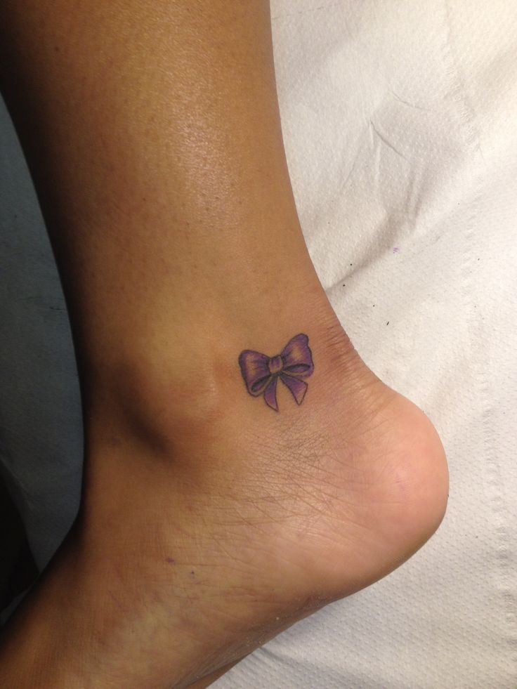 Pink bow and lace Tattoo on skin