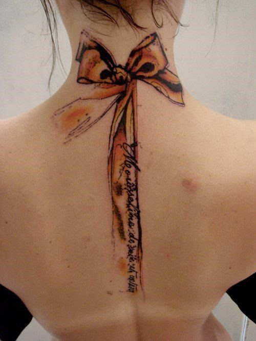 Pink bow tattoo on hip Tattoo on skin