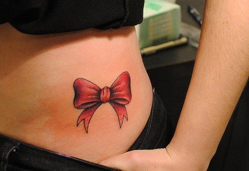Thighs with ribbon tattoos Tattoo on skin