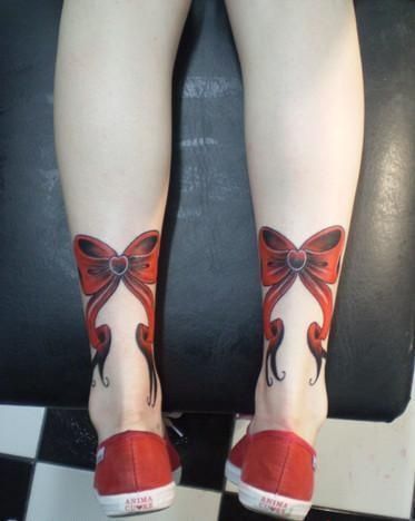 Worn bow tattoo design Tattoo on skin