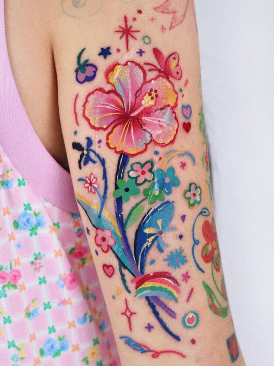 Colorful floral tattoos with a playful vibe Tattoo on skin