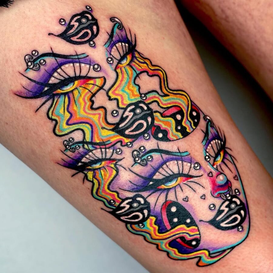 Strikingly vibrant dual-faced tattoo design Tattoo on skin