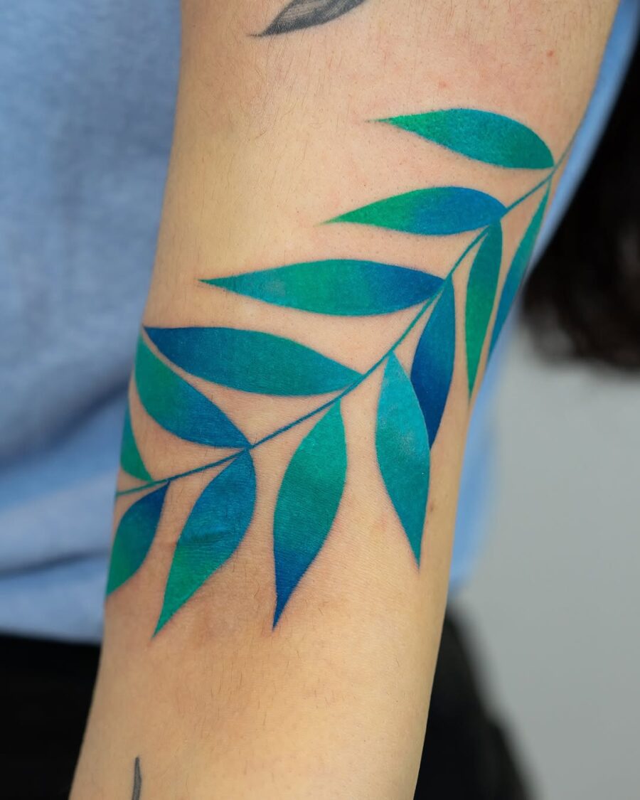 Stunning green and blue leaf tattoo design Tattoo on skin