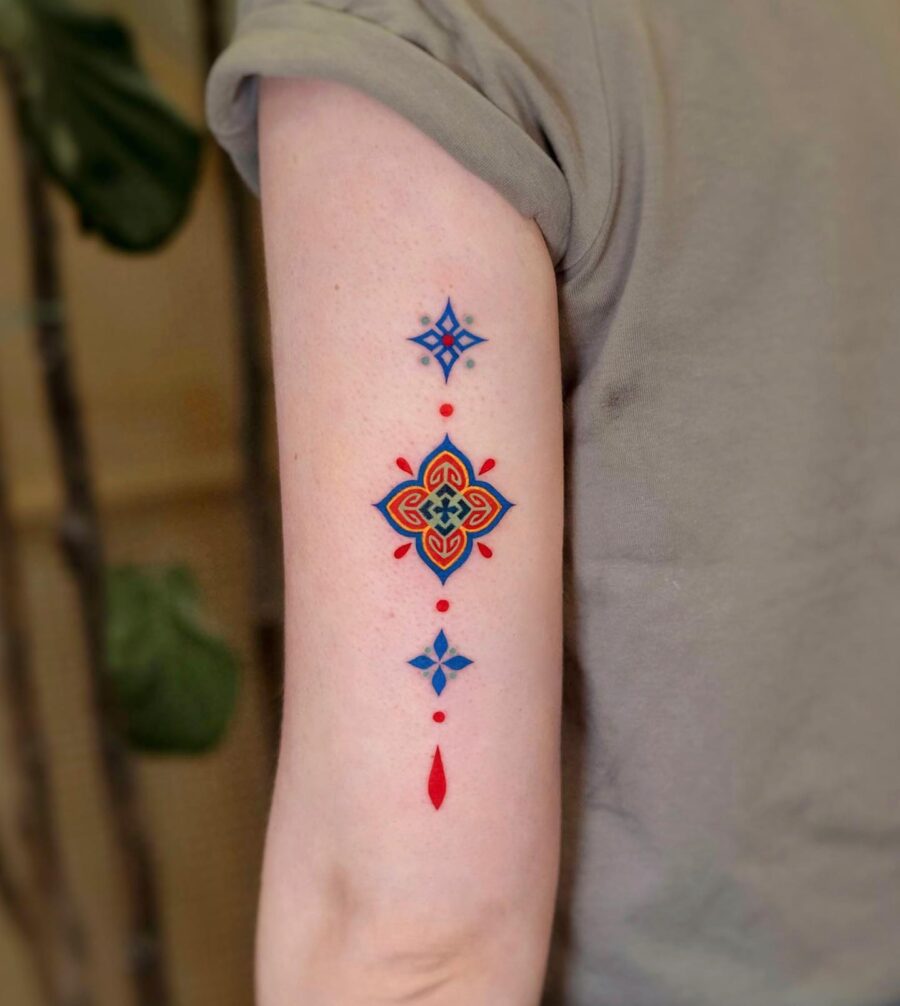 Vibrant geometric tattoo with stunning color contrasts Tattoo on skin