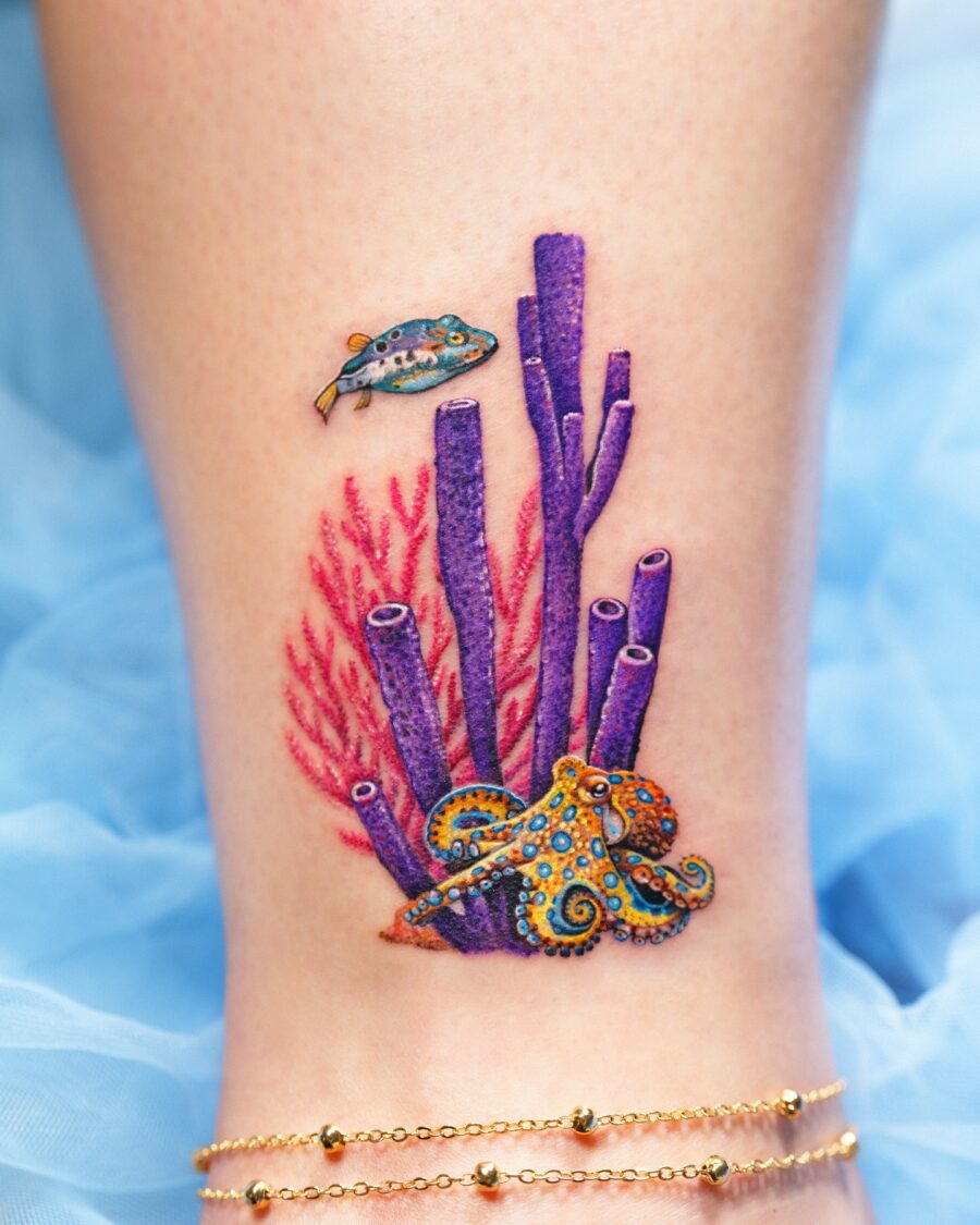 Vibrant underwater scene tattoo featuring an octopus Tattoo on skin
