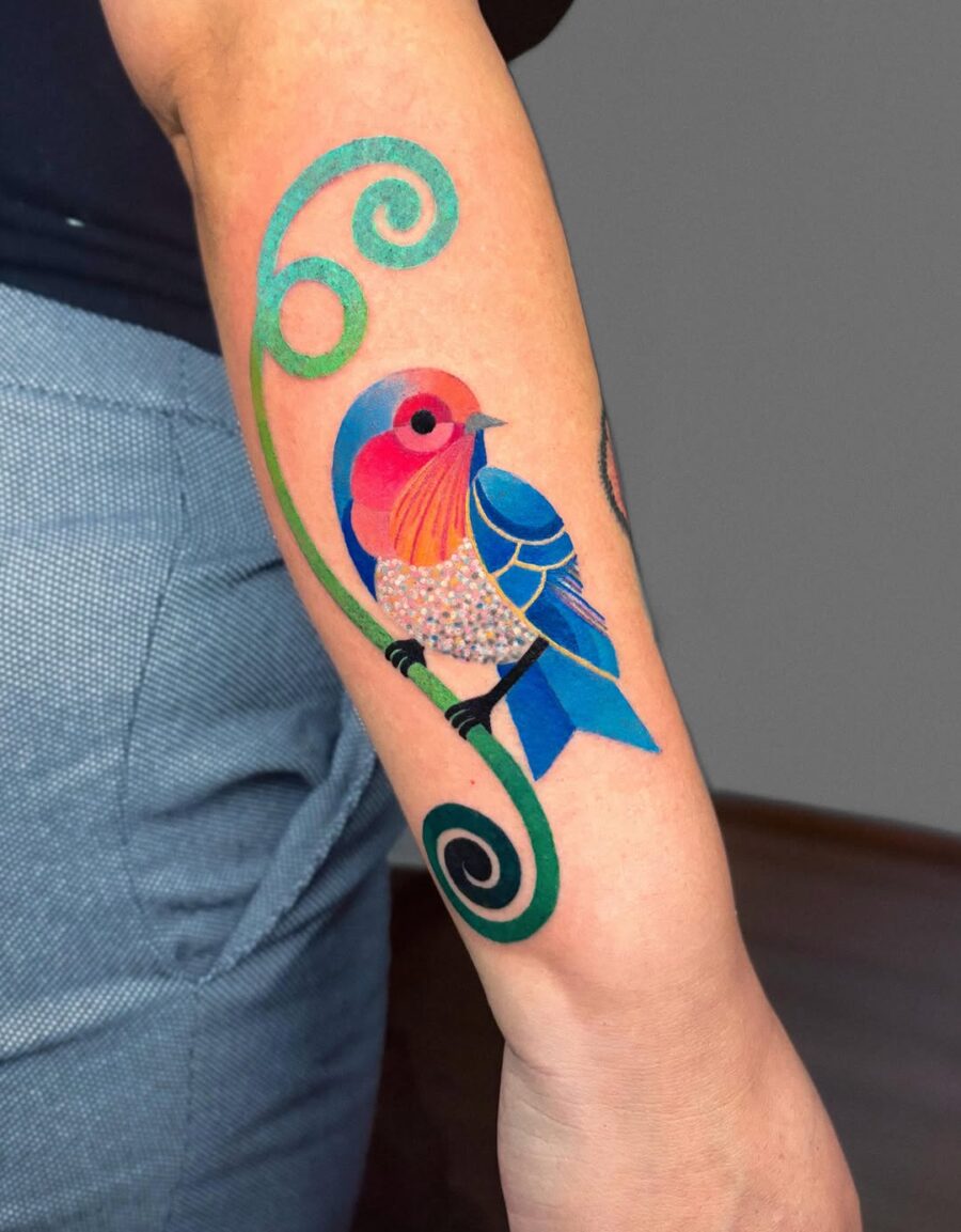 Vivid Bird Tattoo with Whimsical Swirls Tattoo on skin