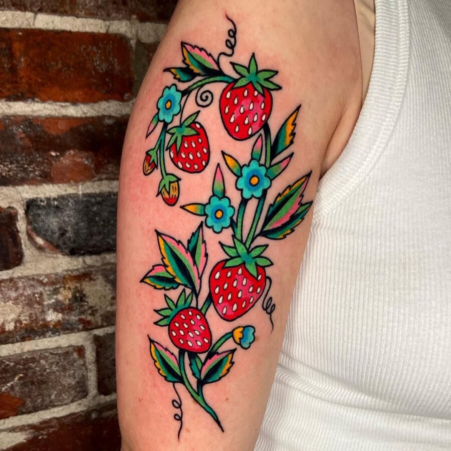 Vivid Strawberry Design on a Bold Background Tattoo on skin