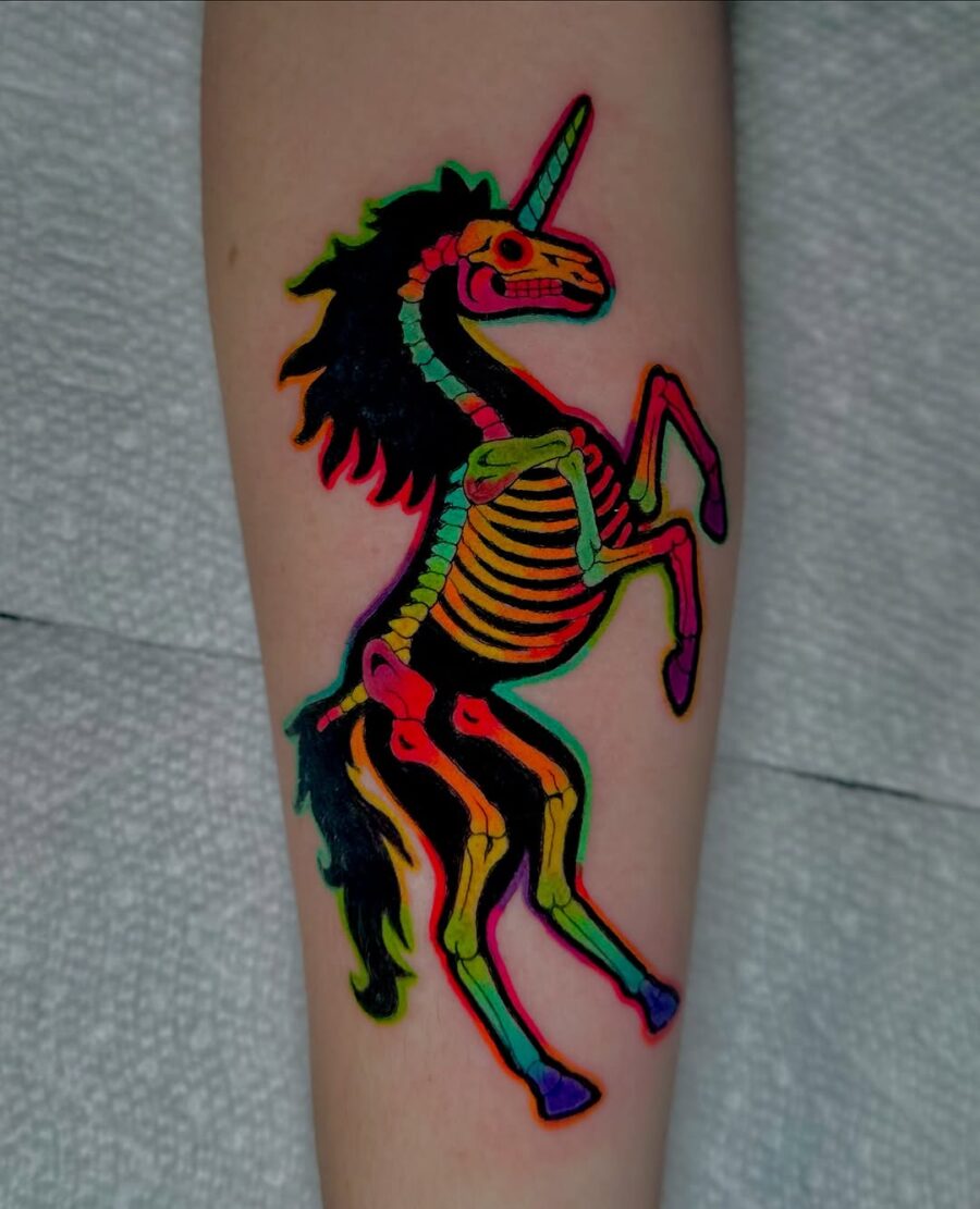 Vividly Colorful Unicorn Skeleton Tattoo Tattoo on skin