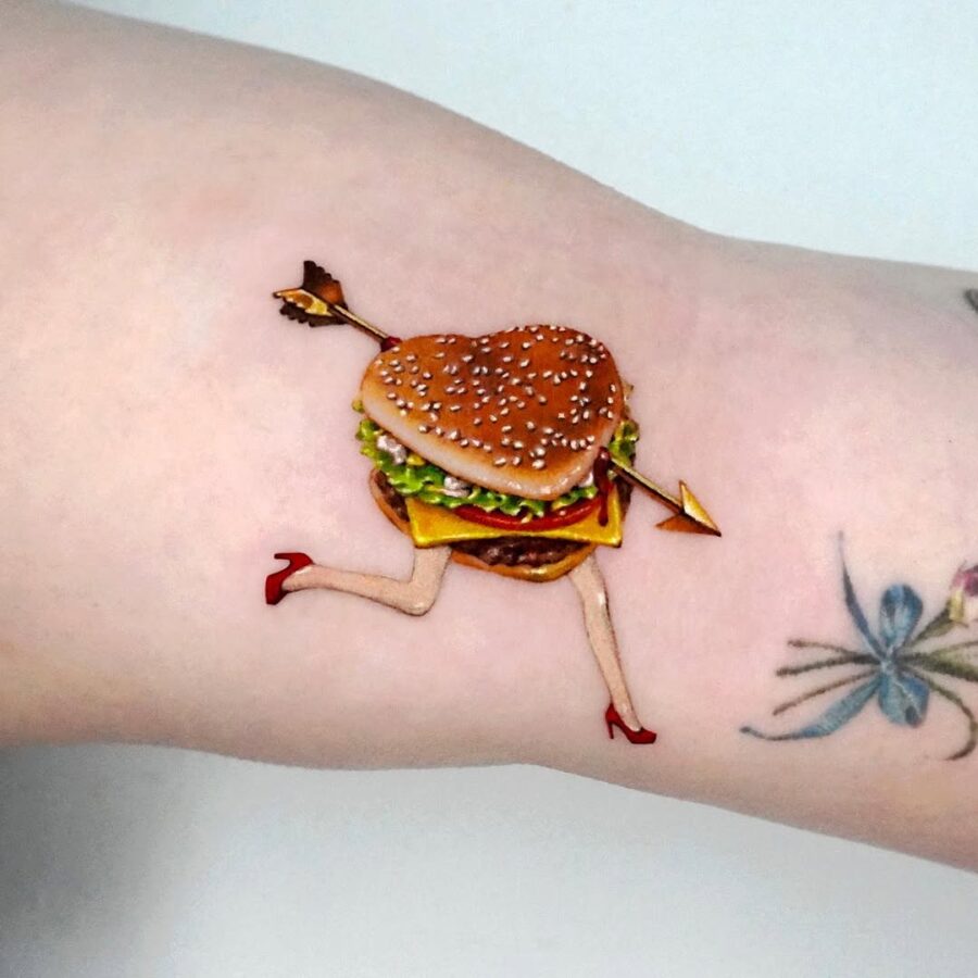 A playful take on burger tattoo art Tattoo on skin