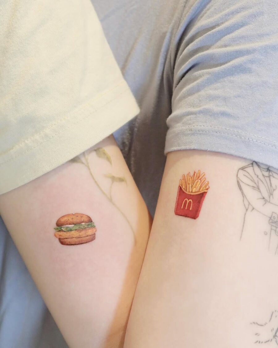 Charming burger and fries arm tattoos Tattoo on skin