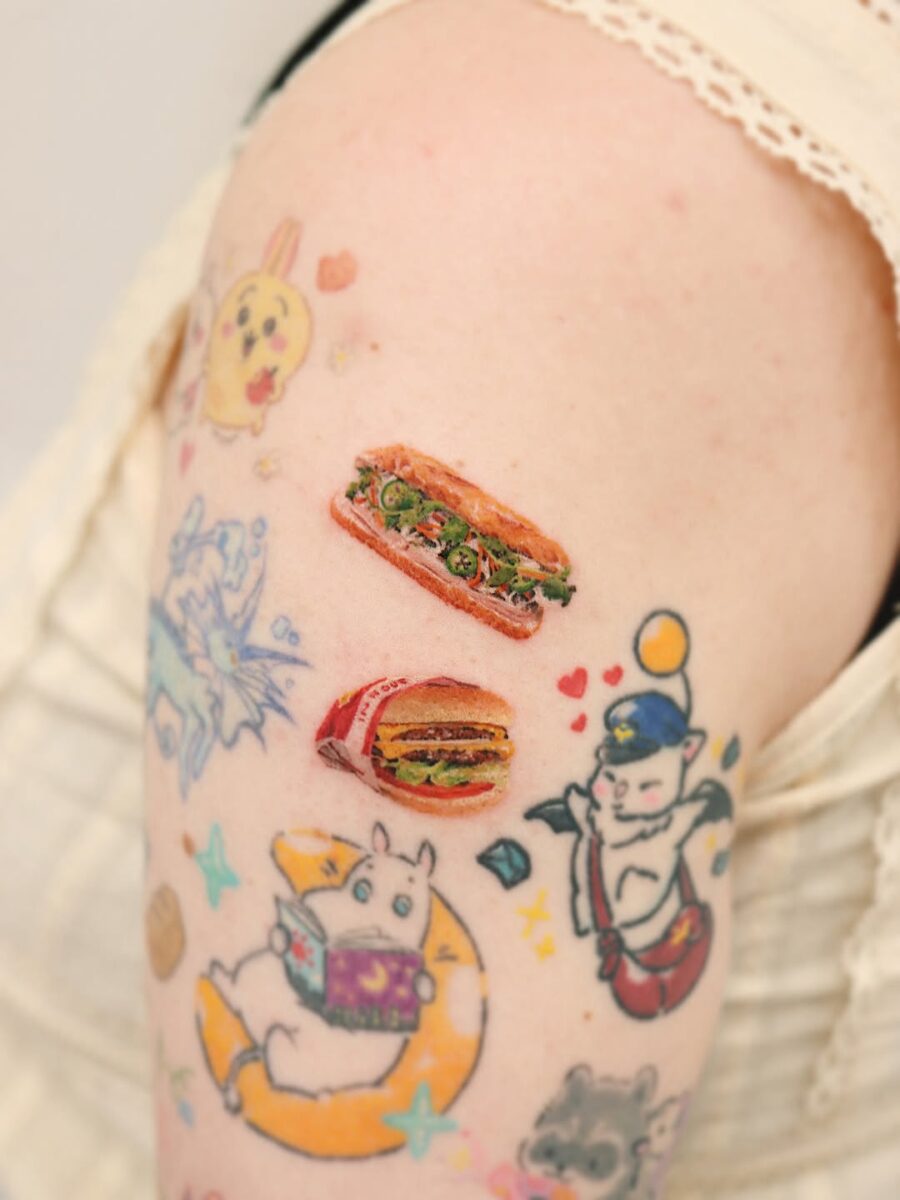 Colorful burger tattoos with playful design elements Tattoo on skin