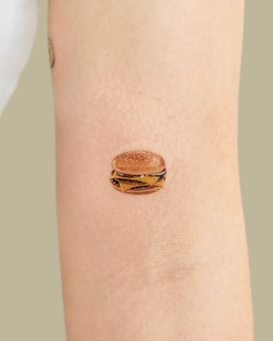 Deliciously detailed burger tattoo on forearm Tattoo on skin