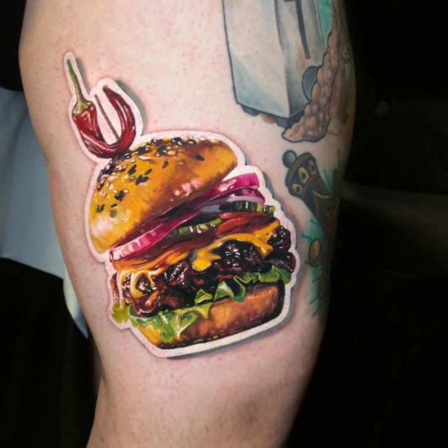 Deliciously vibrant burger tattoo on display Tattoo on skin