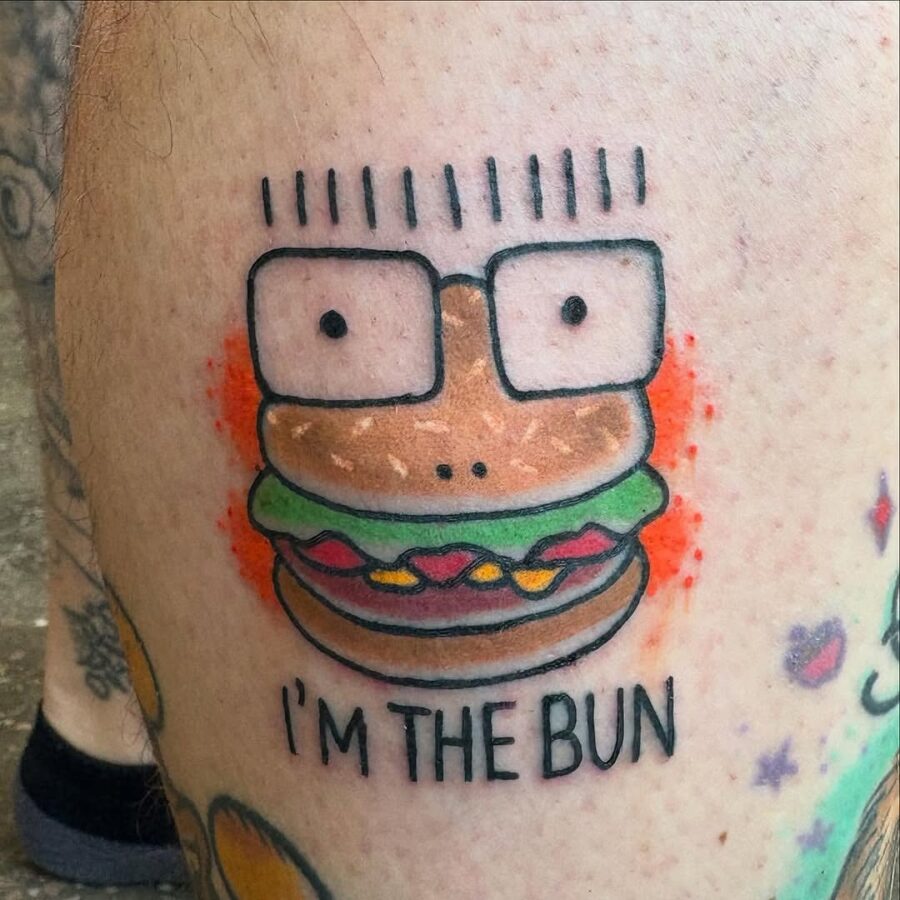 Playful burger character with quirky glasses tattoo Tattoo on skin