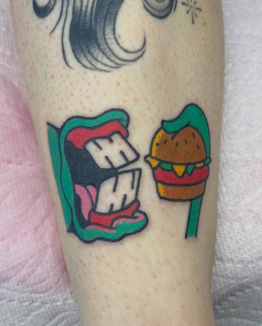 Playful mouth and burger tattoo design Tattoo on skin