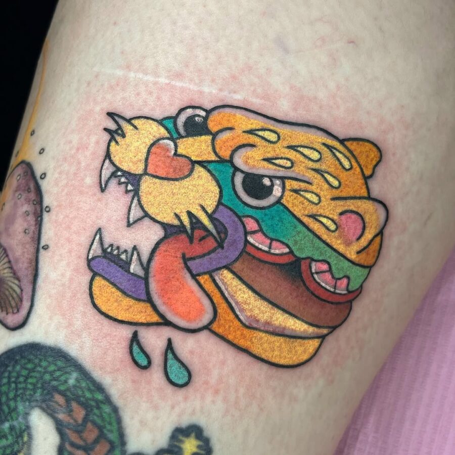 Vibrant burger-inspired tiger tattoo design Tattoo on skin