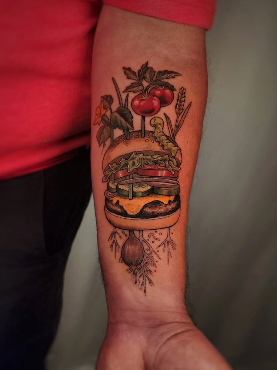 Vibrant burger tattoo with fresh produce elements Tattoo on skin