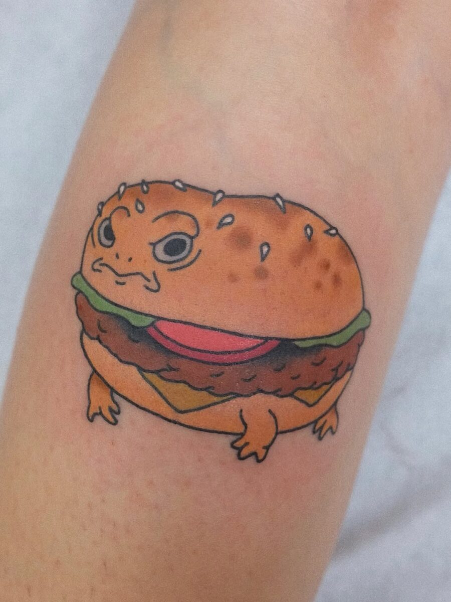 Whimsical burger tattoo with a quirky twist Tattoo on skin