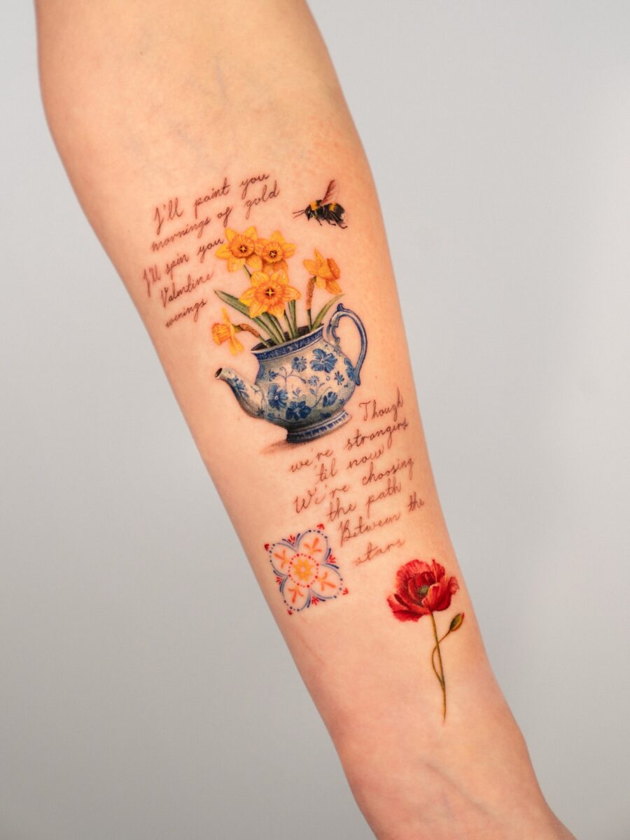 A colorful buttercup flower tattoo sleeve. Tattoo on skin