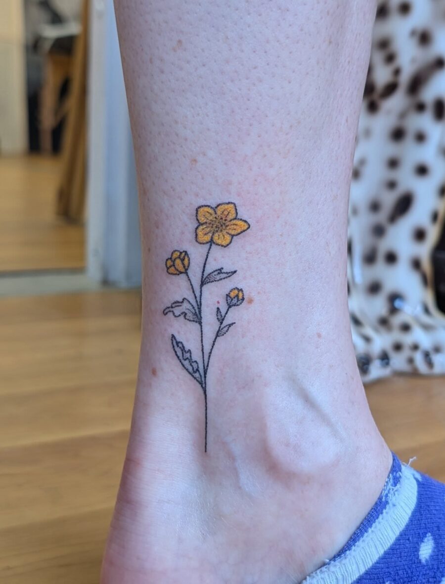 Charming Buttercup Floral Ankle Tattoo Inspiration Tattoo on skin