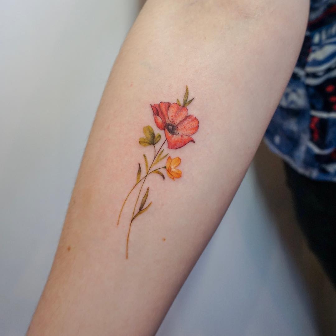 Charming Buttercup Flower Tattoo on Forearm Tattoo on skin