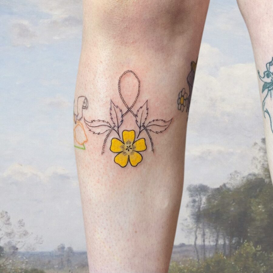 Charming buttercup tattoo on the leg Tattoo on skin