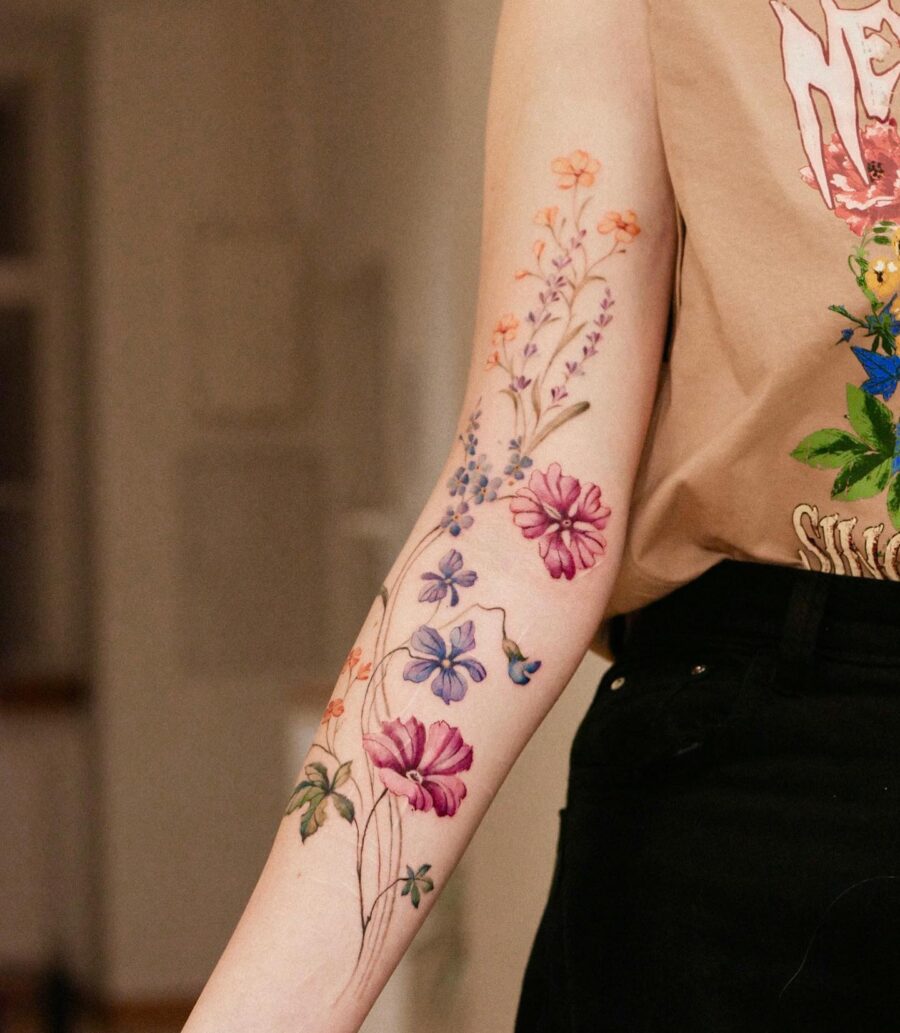 Colorful Blend of Floral Tattoos on Arm Tattoo on skin