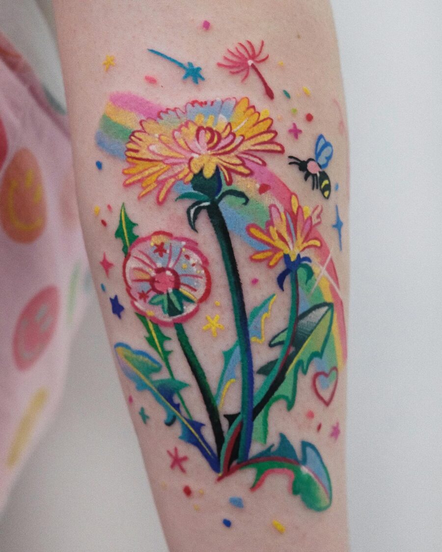 Colorful Buttercup Flower Tattoo with Rainbow Accents Tattoo on skin
