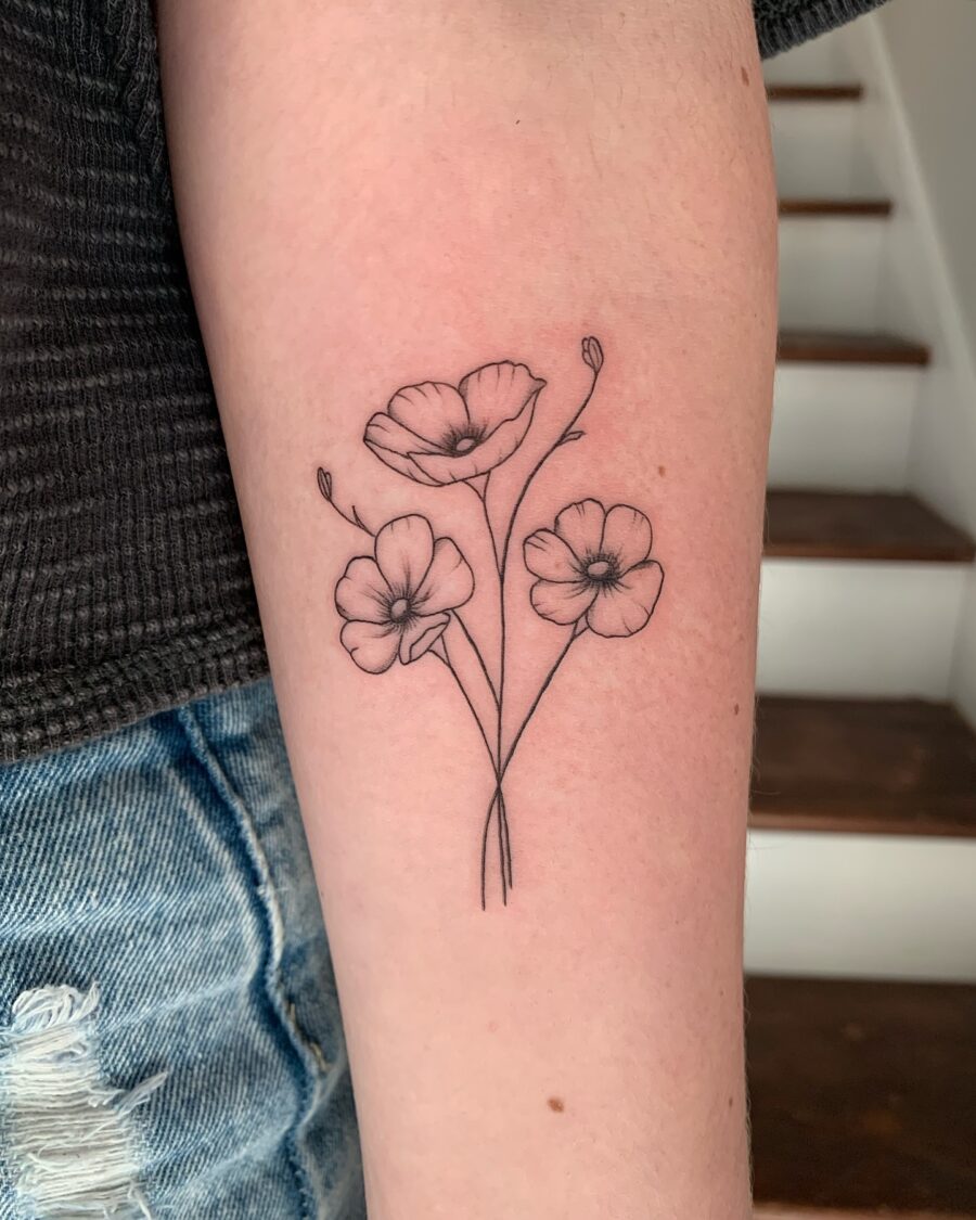 Elegant buttercup floral tattoo design on arm Tattoo on skin