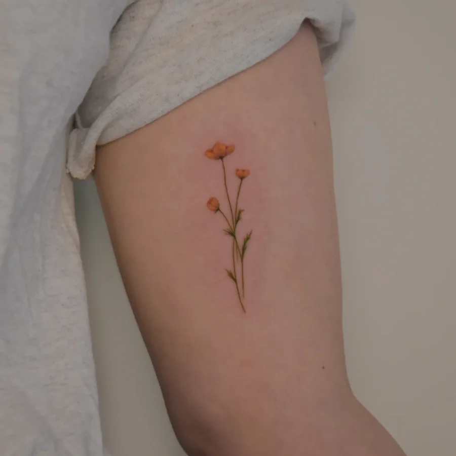 Elegant buttercup flower tattoo on the arm Tattoo on skin