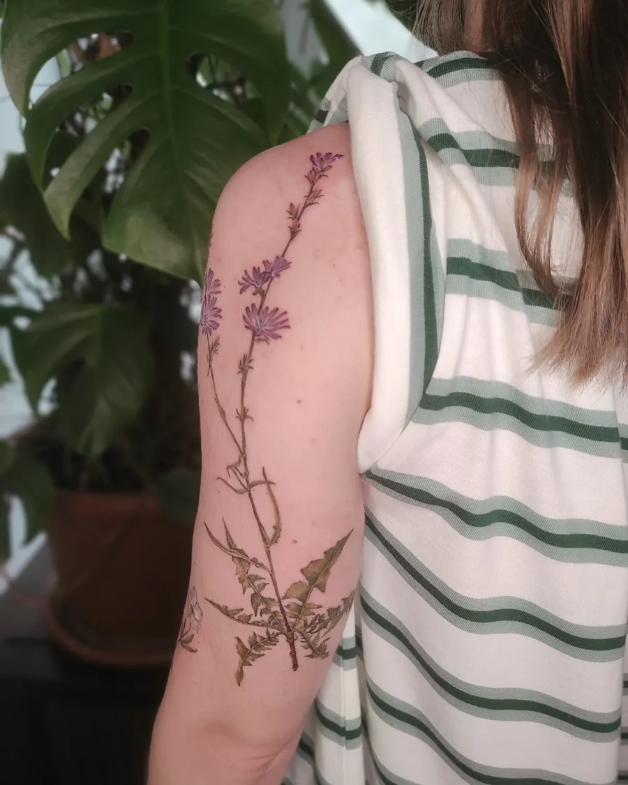 Elegant buttercup flower tattoo on the arm Tattoo on skin