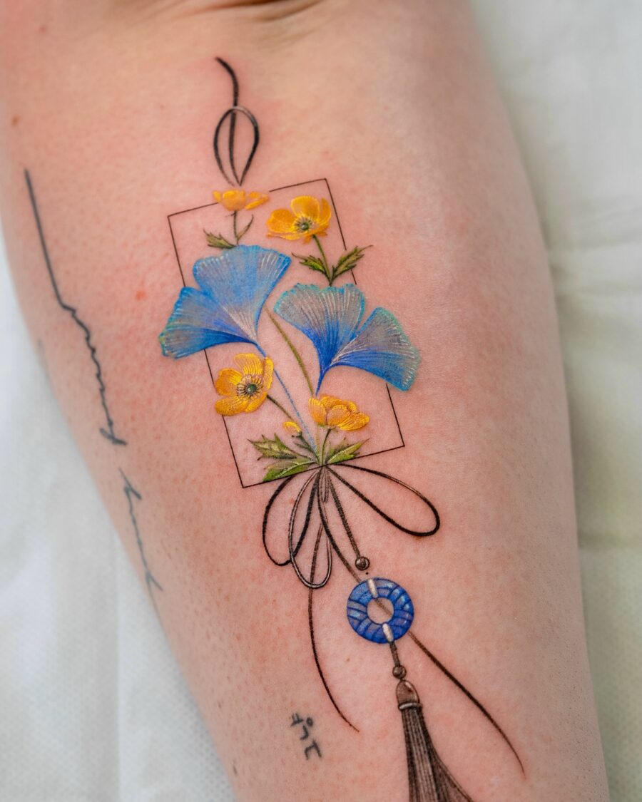 Elegant buttercup flower tattoo with intricate details Tattoo on skin