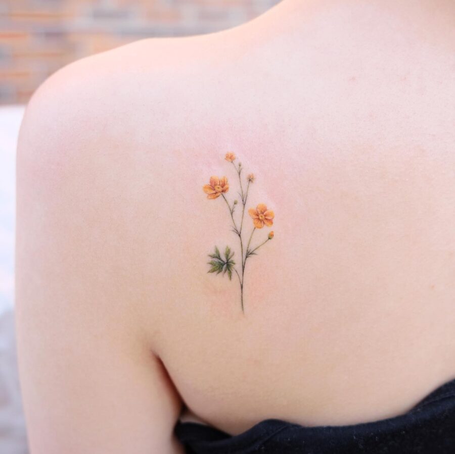 Whimsical buttercup flower tattoo with soft tones Tattoo on skin