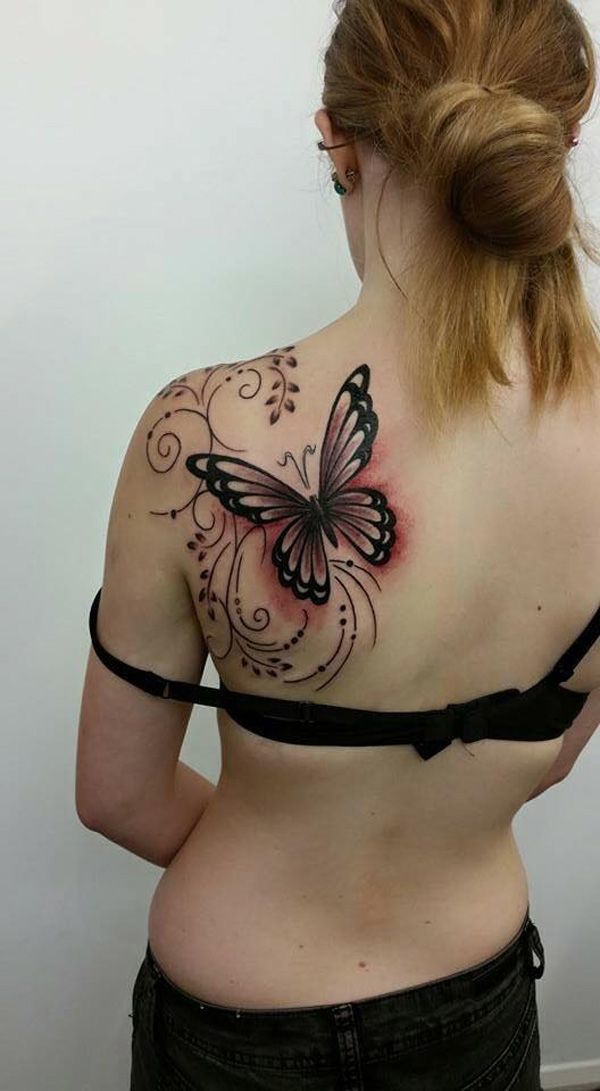 A beautifully decorated butterfly tattoo on the back Tattoo on skin