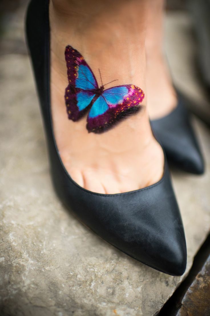 A leg butterfly tattoo Tattoo on skin
