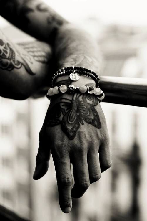 Attractive Butterfly Adorns Man's Hand butterfly tattoos