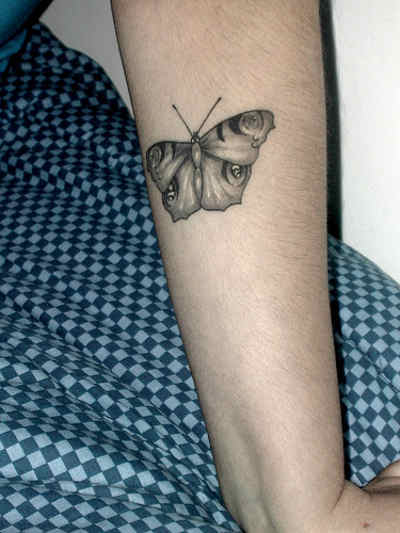 Black Monarch Butterfly on Forearm Tattoo on skin