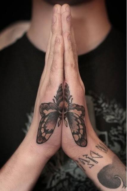 Brown-Black Butterfly Side-Hand Tattoo Tattoo on skin