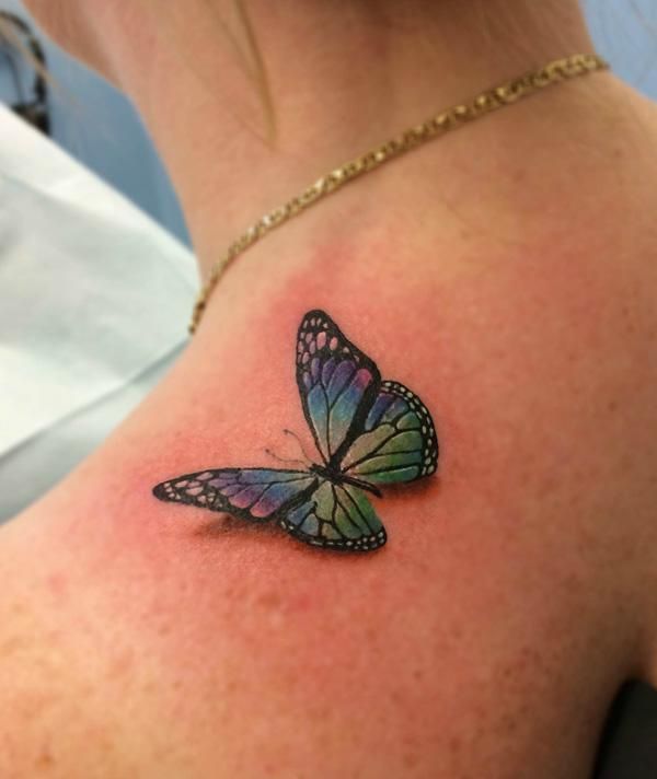 Colored butterfly tattoo Tattoo on skin