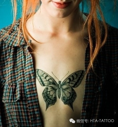 Cool butterfly tattoo on a girl’s chest Tattoo on skin