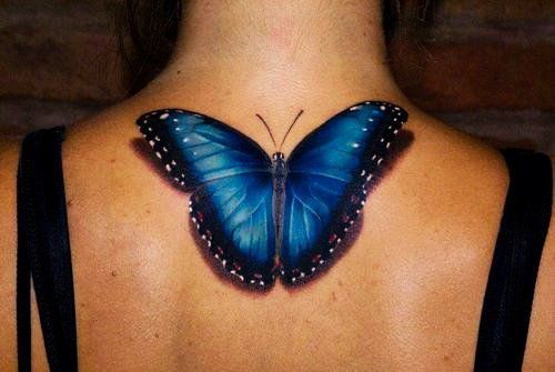 Epic butterfly tattoo on a girl’s back Tattoo on skin