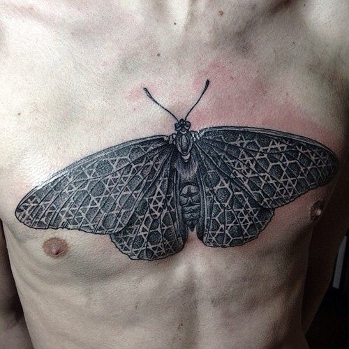 Moth Tattoo Sprawled on Guy's Chest Tattoo on skin
