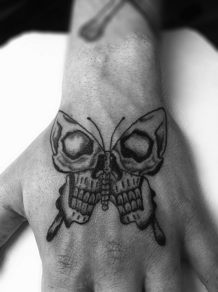 Skull Butterfly Back-Hand Tattoo Tattoo on skin