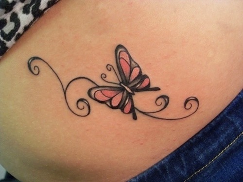 Small butterfly tattoo on a girl’s side Tattoo on skin