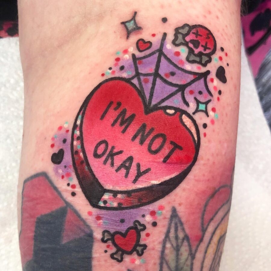 Bold candy heart tattoo expression of emotion Tattoo on skin