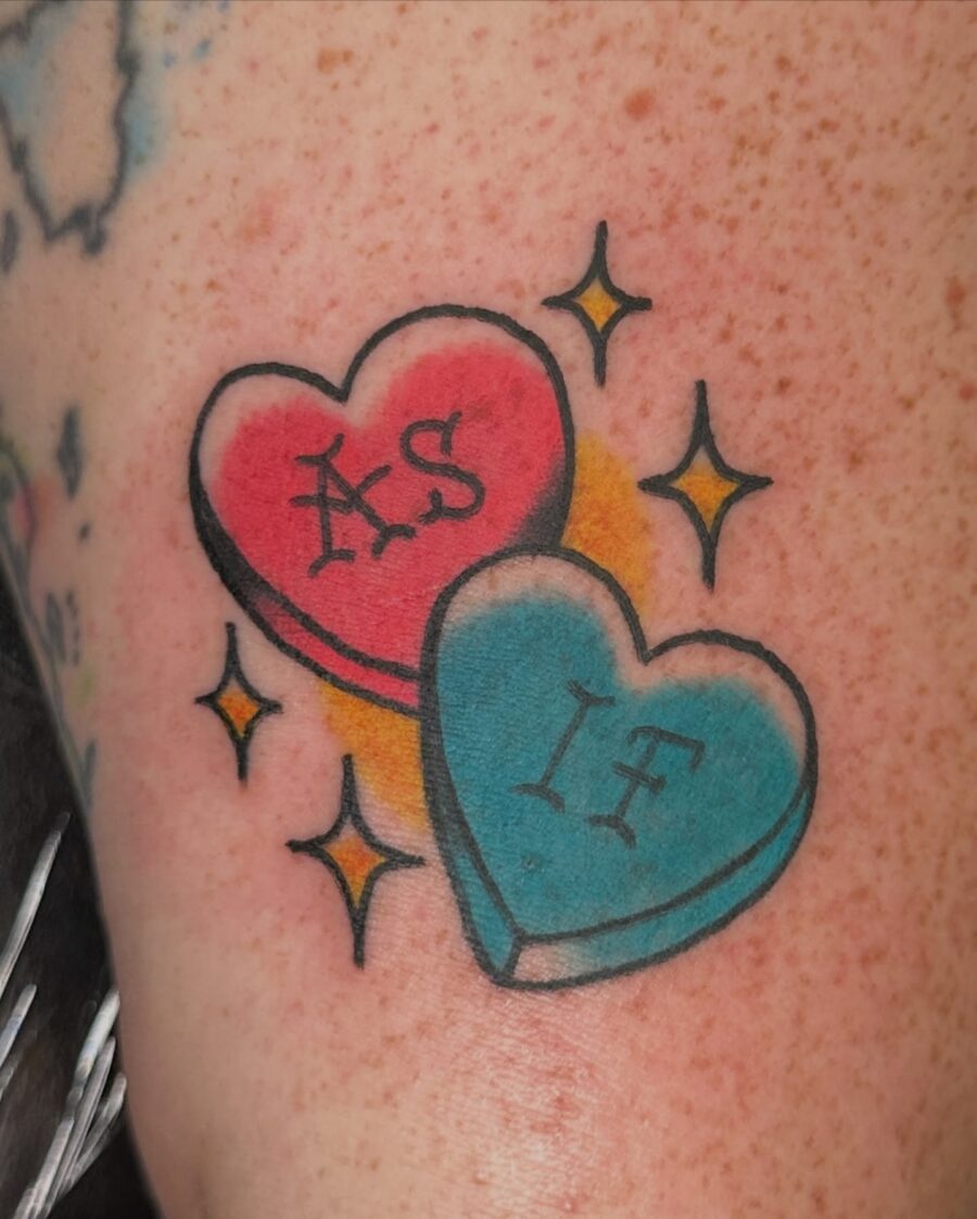 Charming candy heart tattoo design featuring fun phrases Tattoo on skin