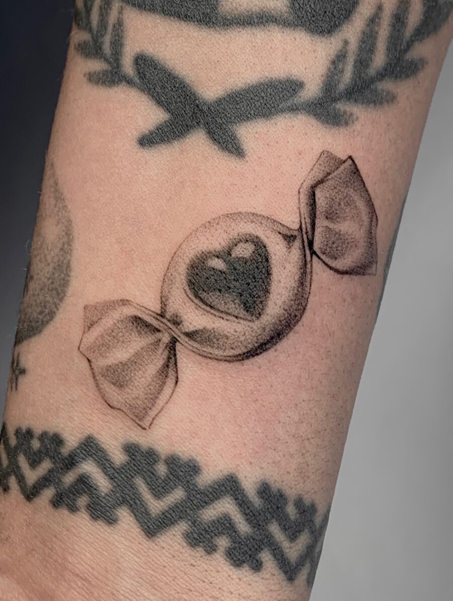 Charming candy heart tattoo with delicate details Tattoo on skin